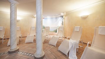Relax in a serene spa area with comfortable lounge chairs and a soothing atmosphere.