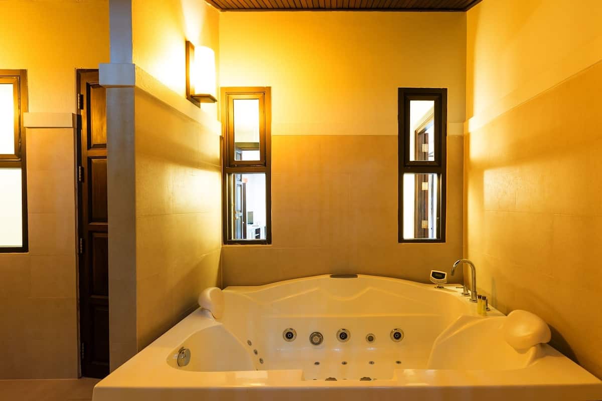 one bedroom jacuzzi villa | bathroom | rainfall showerhead, free toiletries, hair dryer, bathrobes