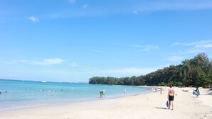 A beach with clear skies, calm waters, and a sandy shore. - Nai Yang Beach Resort & Spa (Sa Khu)