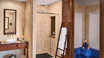 Enjoy a relaxing soak in the bathtub or refresh in the separate shower area.