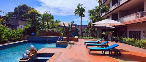Outdoor pool, pool umbrellas, pool loungers