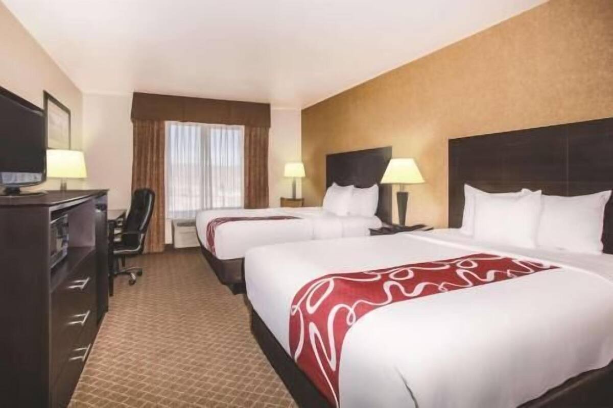 Premium bedding, pillowtop beds, desk, laptop workspace