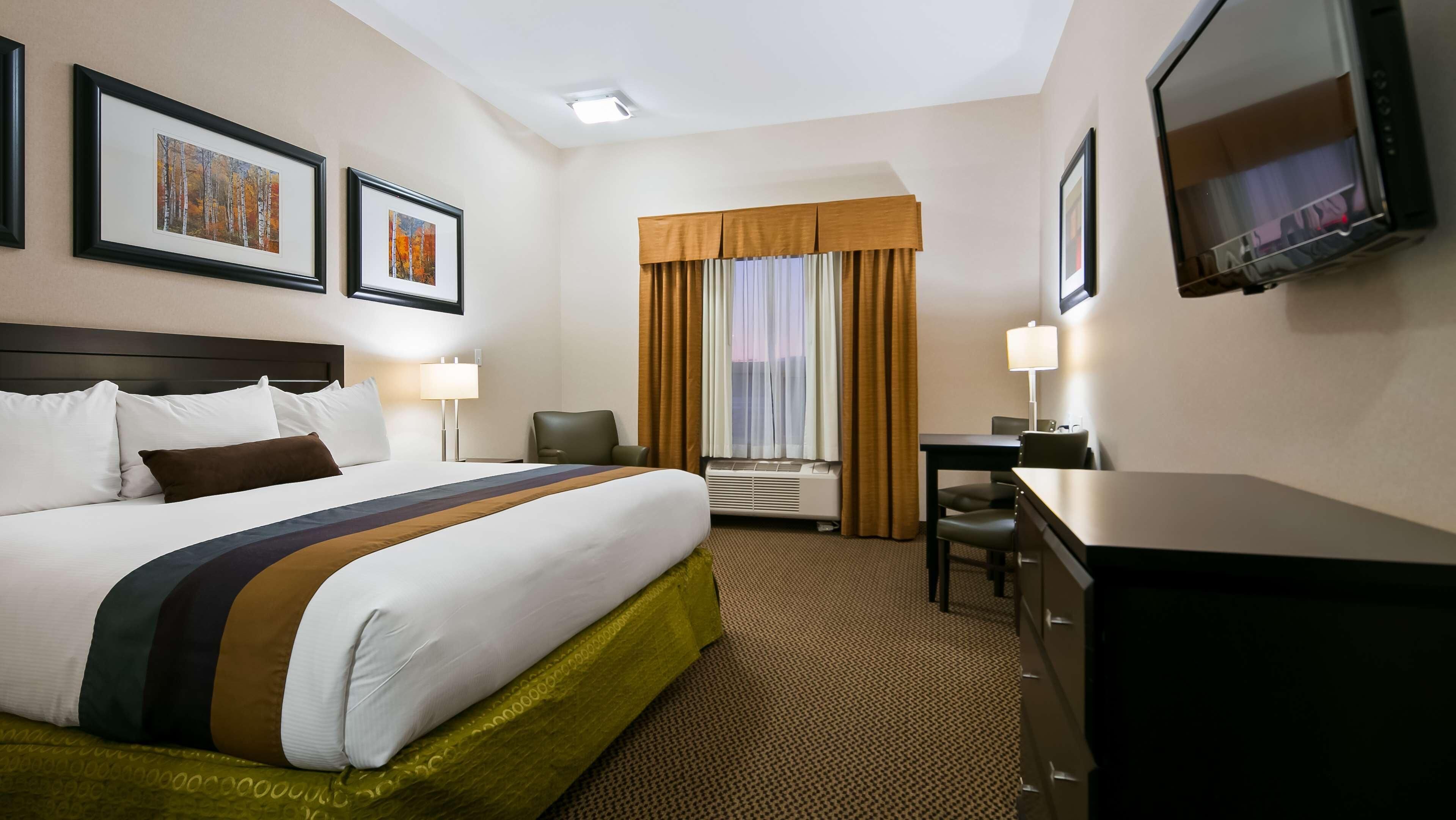 Premium bedding, desk, laptop workspace, iron/ironing board