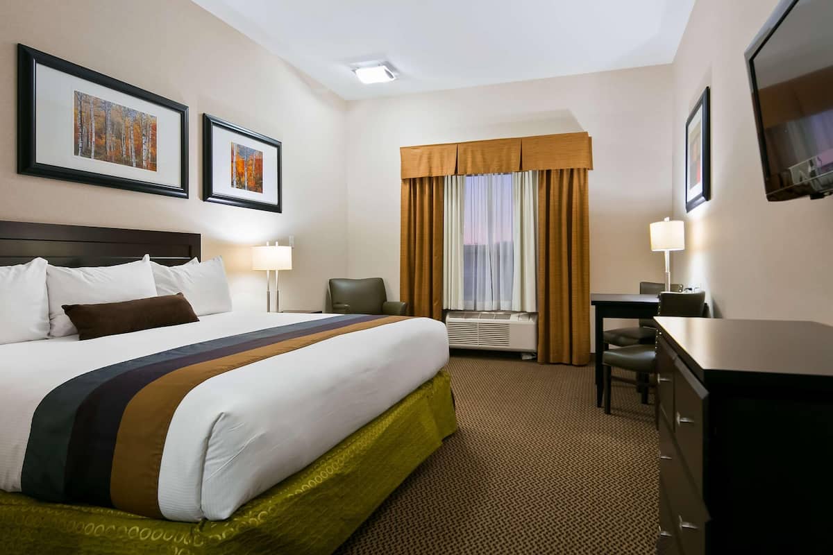 Premium bedding, desk, laptop workspace, iron/ironing board