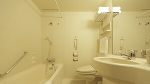 Ein modernes Badezimmer mit Badewanne, Toilette und Waschbecken.