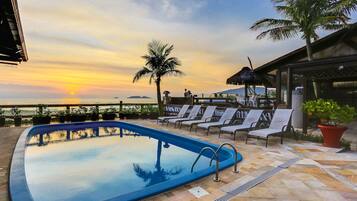 Indoor pool, outdoor pool, pool umbrellas, pool loungers