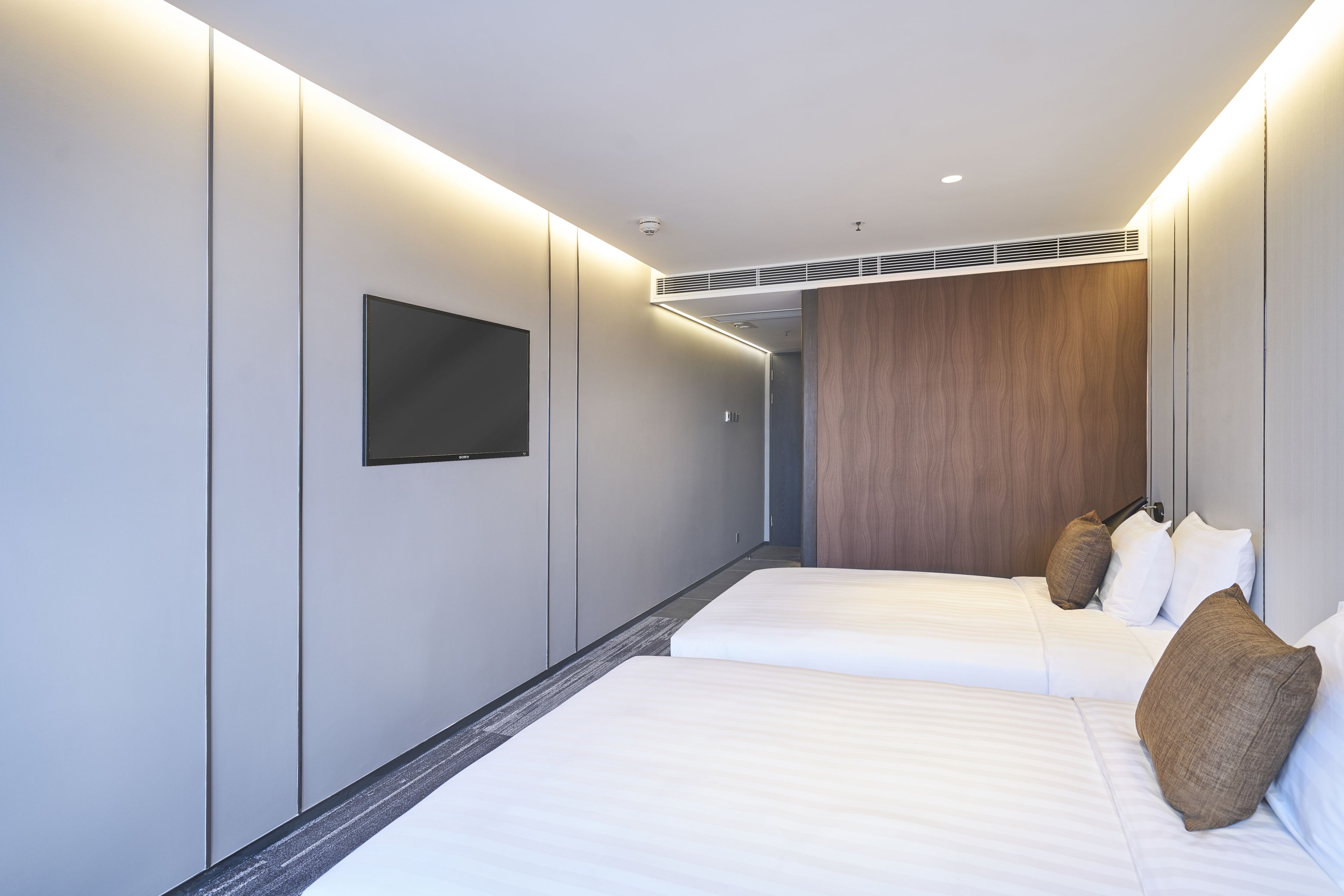 cozi family room | minibar, in-room safe, desk, blackout curtains