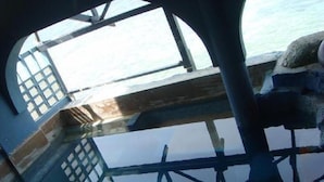 An underwater view of a ship's deck with a clear view of the ocean. - Anthonys Beach Resort (Moalboal)