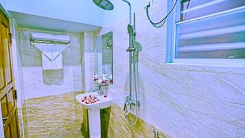 Shower, free toiletries, slippers, towels
