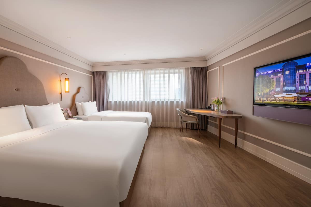 Family Room, 2 Double Beds | Down comforters, minibar, in-room safe, desk