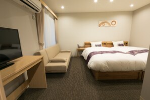 A hotel room with a bed, a TV, a sofa, and a desk. - Stay SAKURA Kyoto Gyoen East (Kyoto)