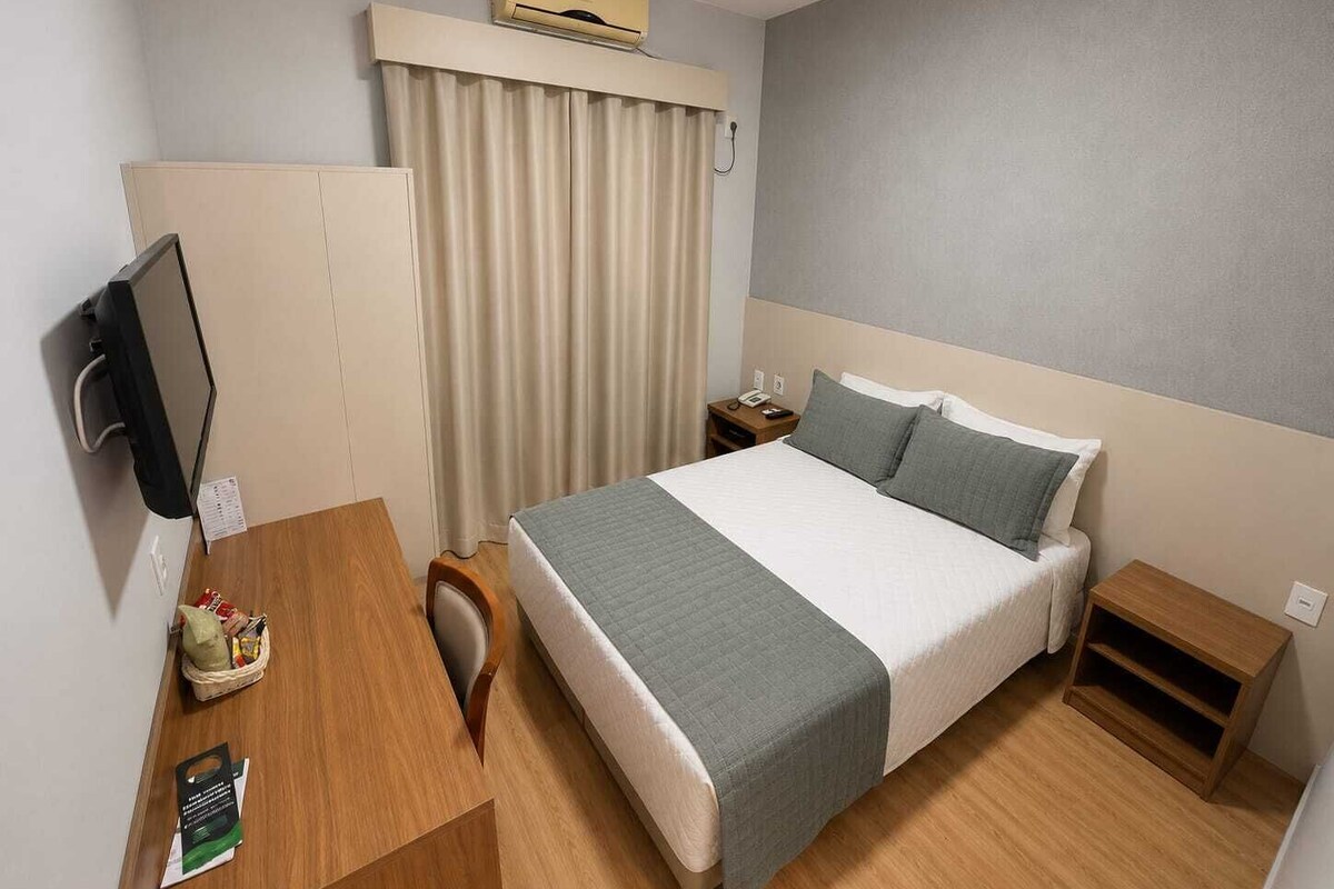 Standard Double Room | Minibar, in-room safe, desk, blackout drapes