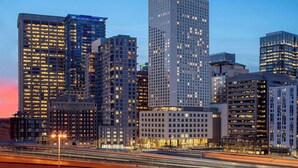 A high-rise urban skyline with illuminated windows and a bridge with light trails. - Hyatt Regency Seattle (Seattle)