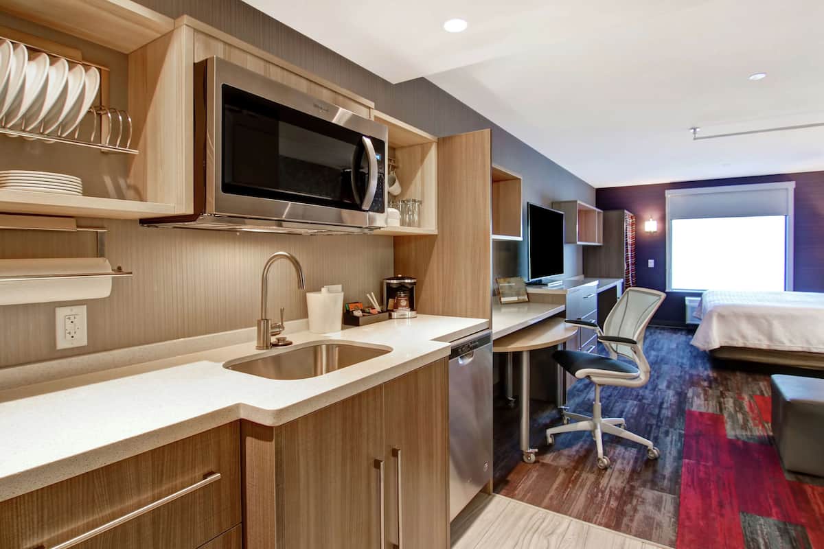 Studio Suite, 1 King Bed, Non Smoking | Desk, blackout drapes, iron/ironing board, cribs/infant beds