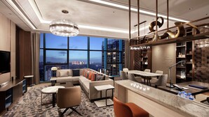 A modern hotel lobby with a large seating area, a bar, and a view of the cityscape. - Doubletree by Hilton Yangzhou (Yangzhou)