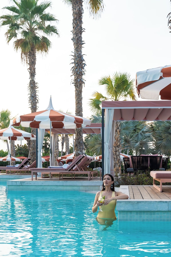 2 outdoor pools, open 7:00 AM to 7:00 PM, free pool cabanas