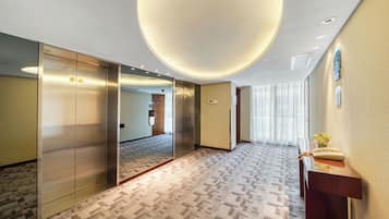 Premium bedding, desk, laptop workspace, soundproofing