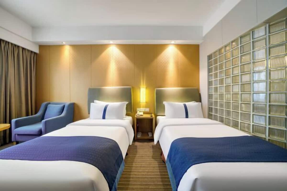 Premium bedding, desk, laptop workspace, soundproofing