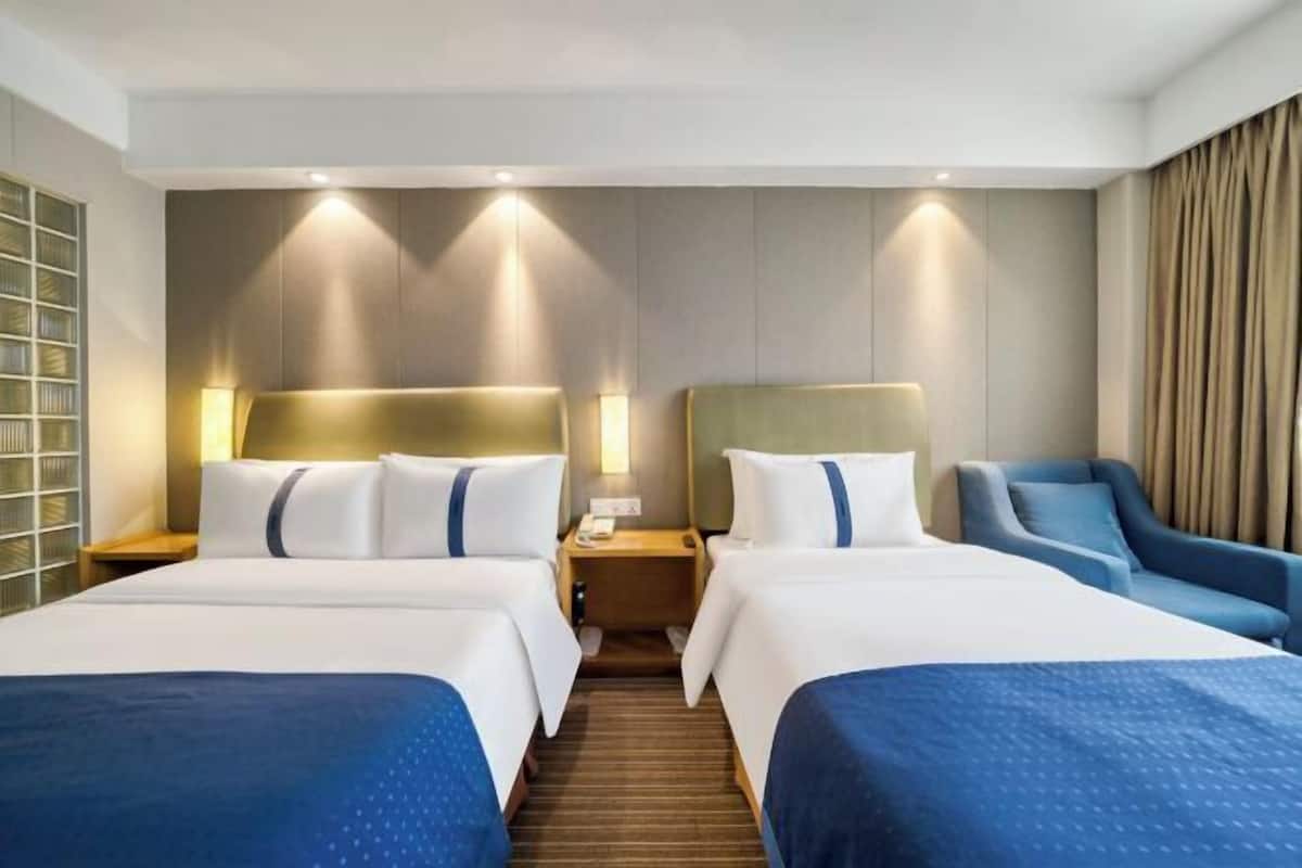 Premium bedding, desk, laptop workspace, soundproofing