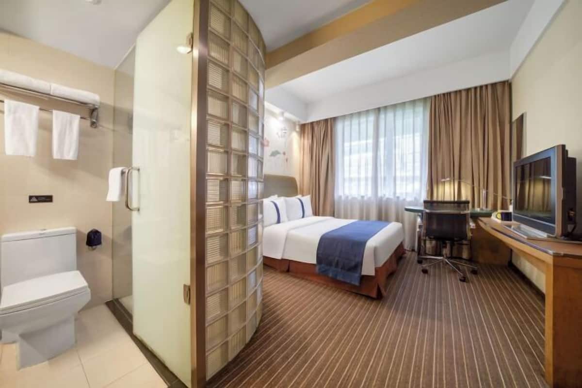 Premium bedding, desk, laptop workspace, soundproofing
