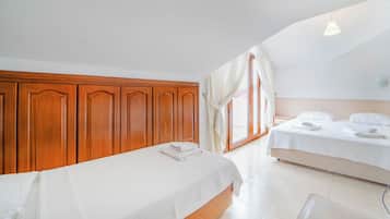 Standard Triple Room | Living area | 45-inch LCD TV with satellite channels