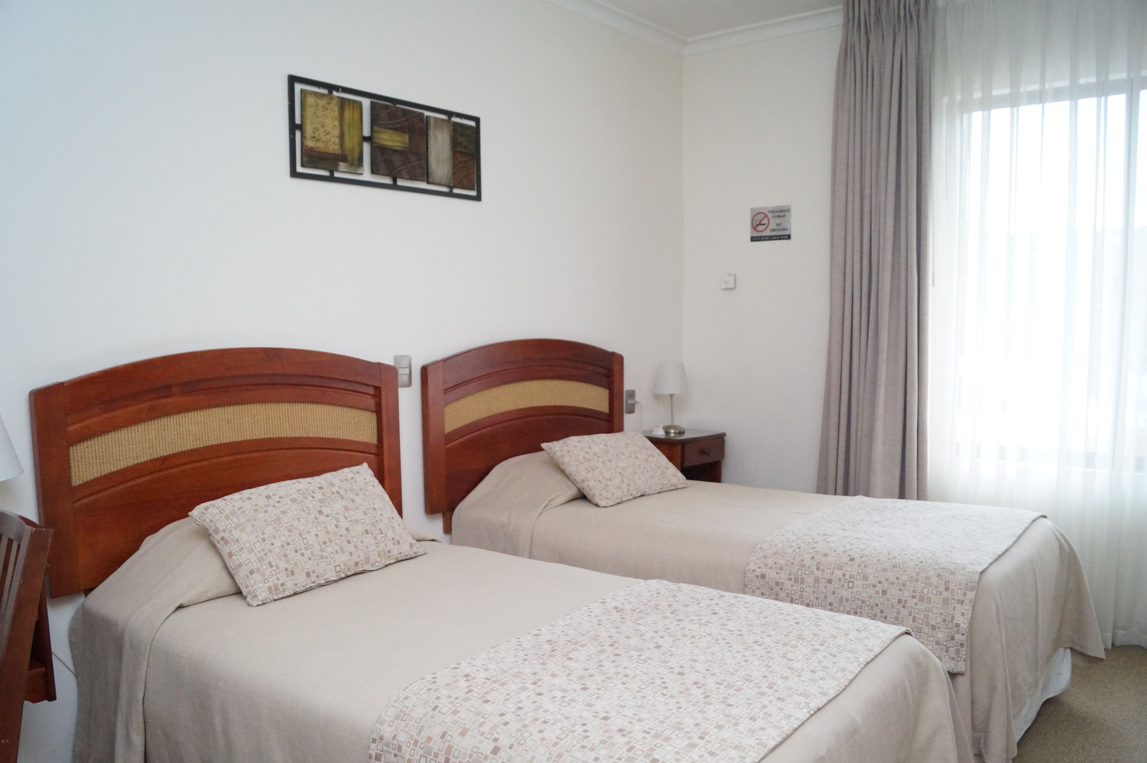 twin room, 2 single beds, non smoking, private bathroom | in-room safe, desk, blackout curtains, iron/ironing board