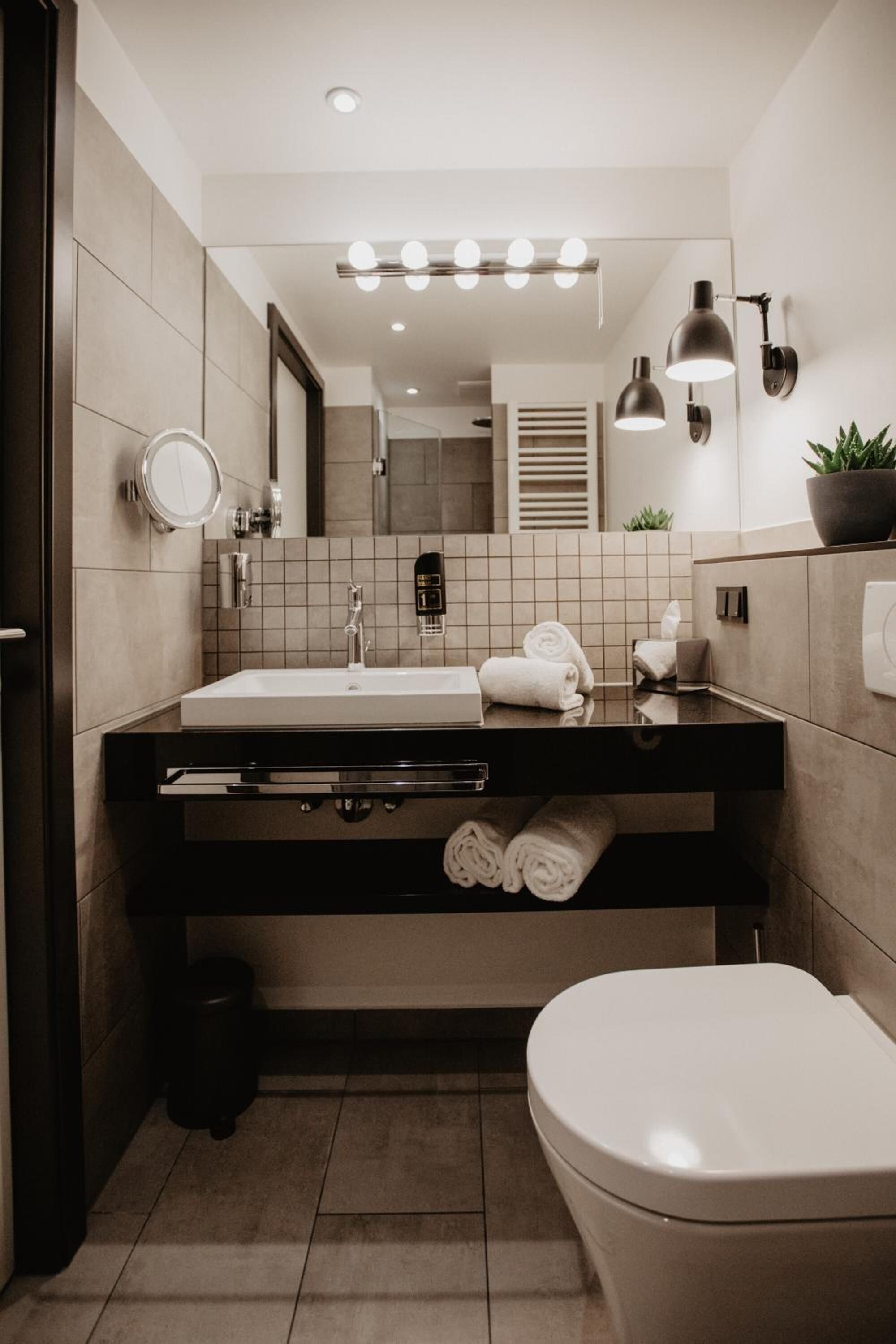 shower, rainfall showerhead, hair dryer, towels