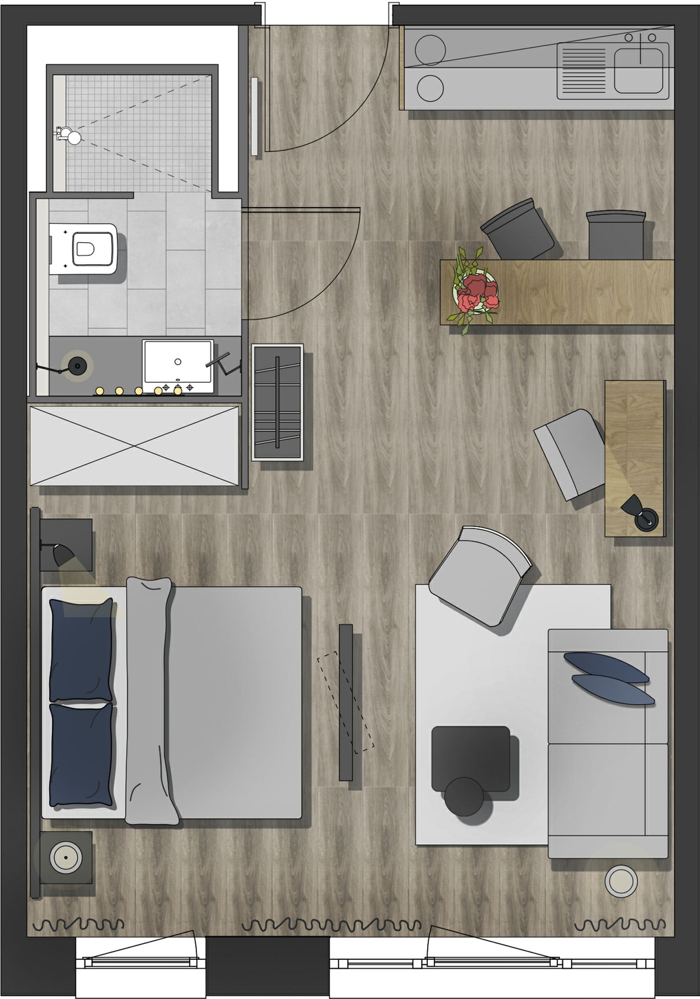 Vista cenital de una habitación de hotel con cama, escritorio, baño y kitchenette.