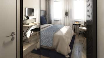 A modern hotel room with a bed, desk, chair, and a small table with a bowl of fruit.