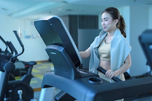 A person using a treadmill in a gym with exercise equipment in the background. - Holiday Inn Express Jakarta Menteng by IHG (Jakarta)
