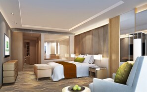 A modern hotel room with a large bed, a seating area, a TV, and a minibar. - Holiday Inn Wuxi Taihu New City by IHG (Wuxi)