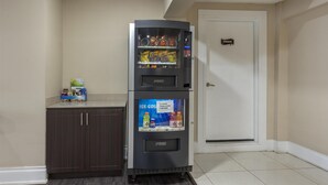 A vending machine with a 'PUSH' button, a 'PRIVATE' sign, and a 'Ice Cold' label. - SureStay Hotel by Best Western Kemptville (North Grenville)
