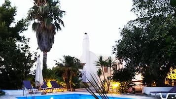 Seasonal outdoor pool, pool umbrellas, pool loungers