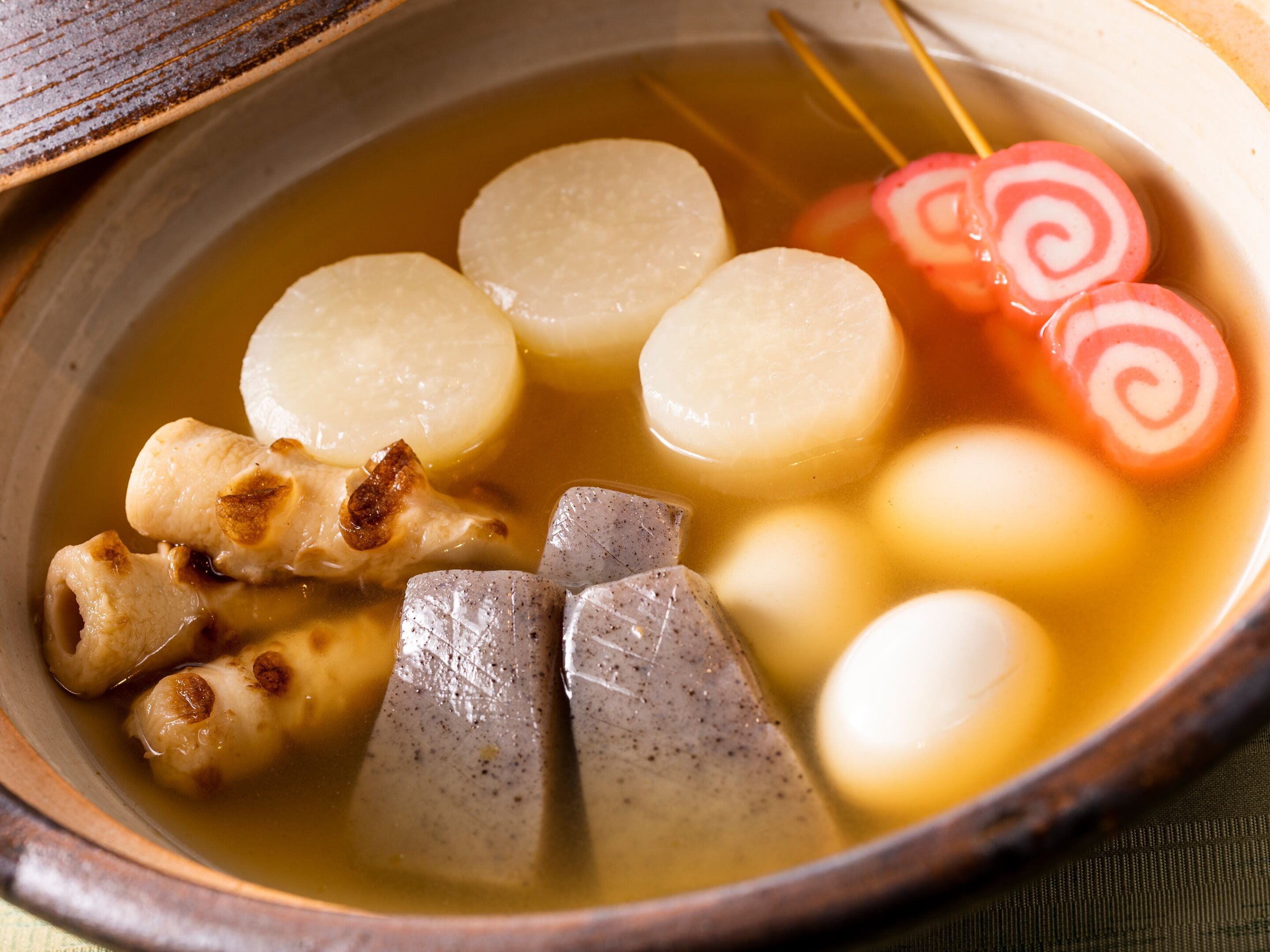A bowl of soup with various ingredients.