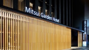 The exterior of the Mitsui Garden Hotel with a modern facade and illuminated signage. - Mitsui Garden Hotel Kanazawa (Kanazawa)