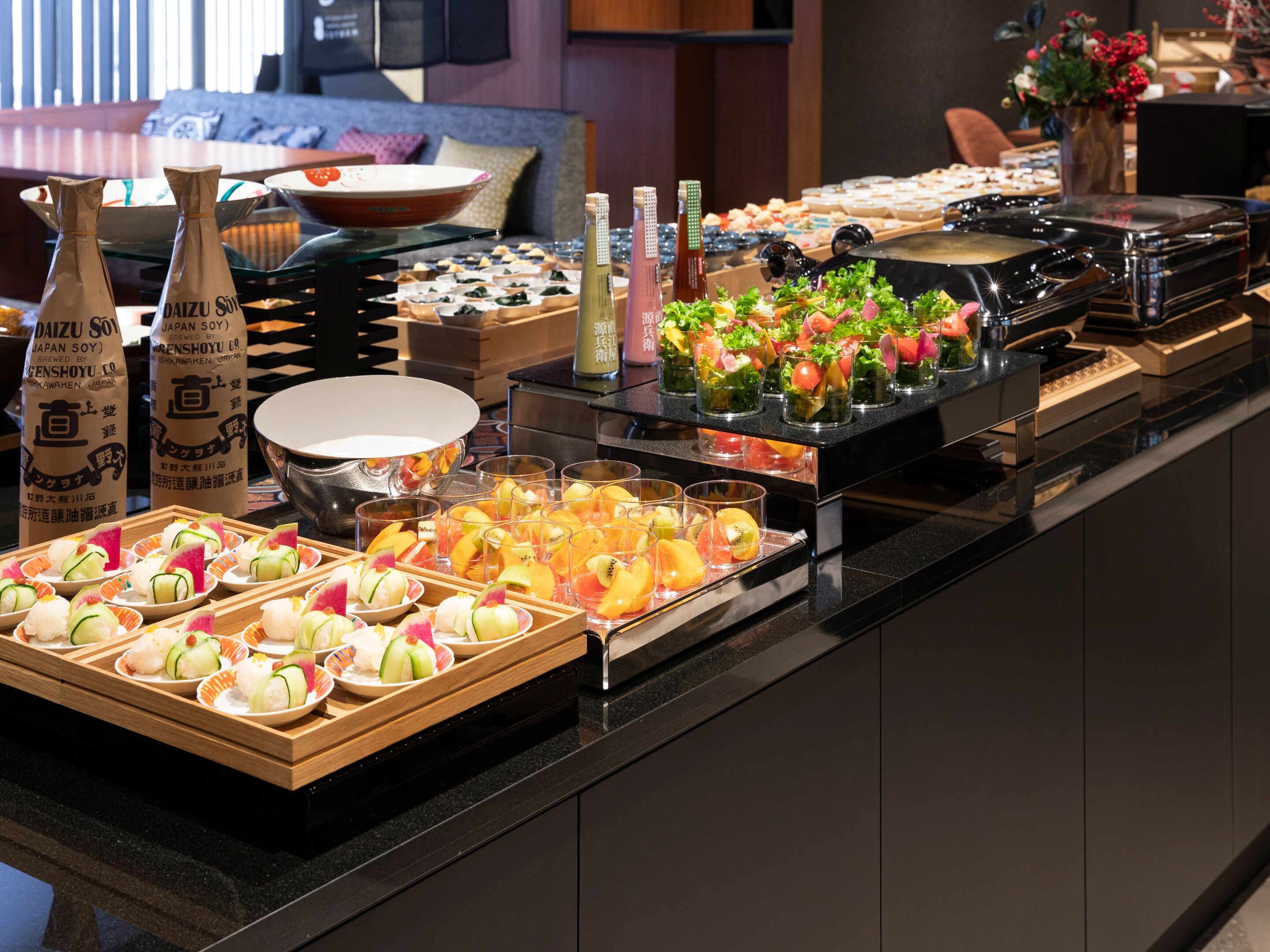 A buffet with various food items and beverages.
