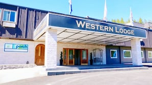 A Western Lodge building with a covered entrance, a porch, and a sign. - Western Lodge (Kimberley)