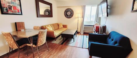 Family Suite, 1 Bedroom | Living area | 42-inch LED TV with cable channels, TV