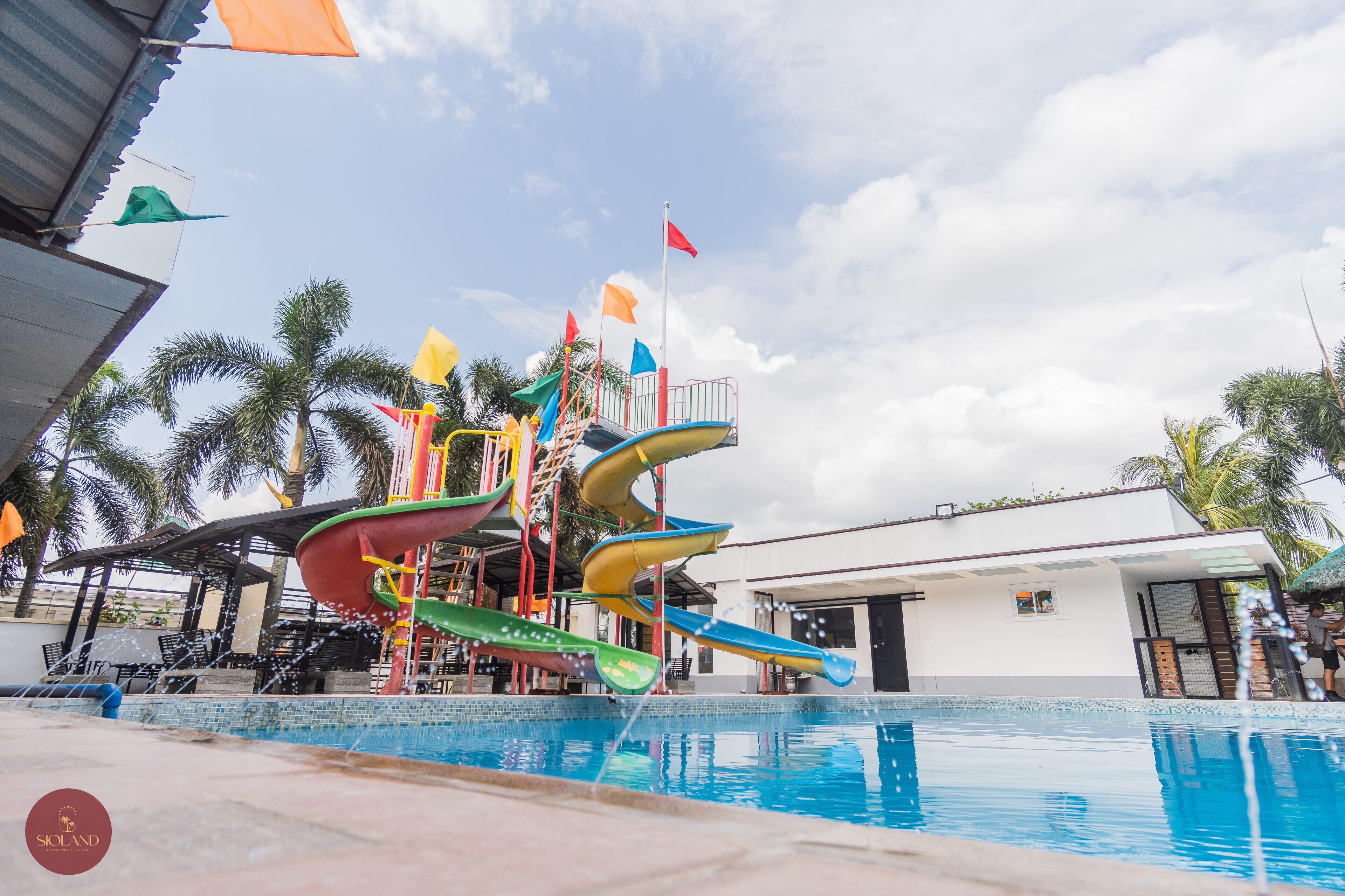 A water park with multiple slides and a pool.