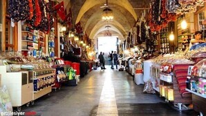An indoor market with arched ceilings and various stalls selling goods. - Yilmazel Hotel (Gaziantep)