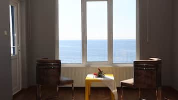 Junior Studio Suite, 1 Bedroom, Sea View | Minibar, desk, soundproofing, iron/ironing board