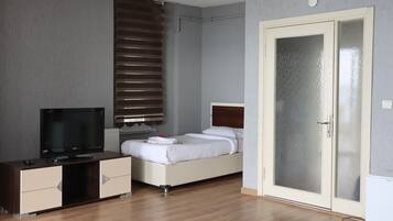 Junior Studio Suite, 1 Bedroom, Sea View | Minibar, desk, soundproofing, iron/ironing board