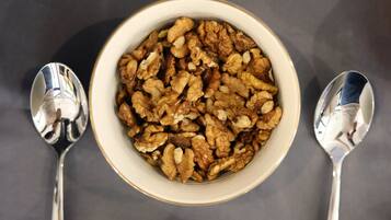 Three bowls of food items on a table.