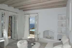 Deluxe Villa, 4 Bedrooms, Private Pool | Living room | Flat-screen TV, fireplace, MP3 dock