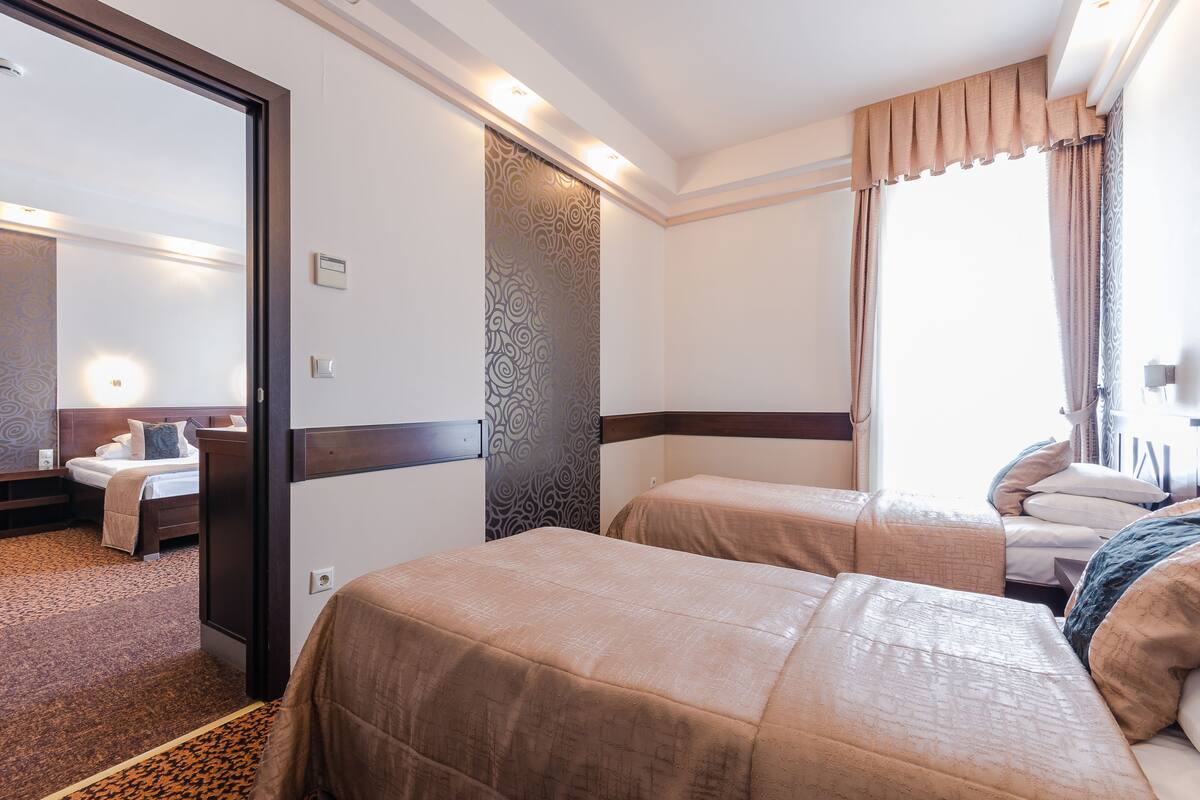 Family Apartment, 2 Bedrooms | Minibar, in-room safe, blackout drapes, bed sheets