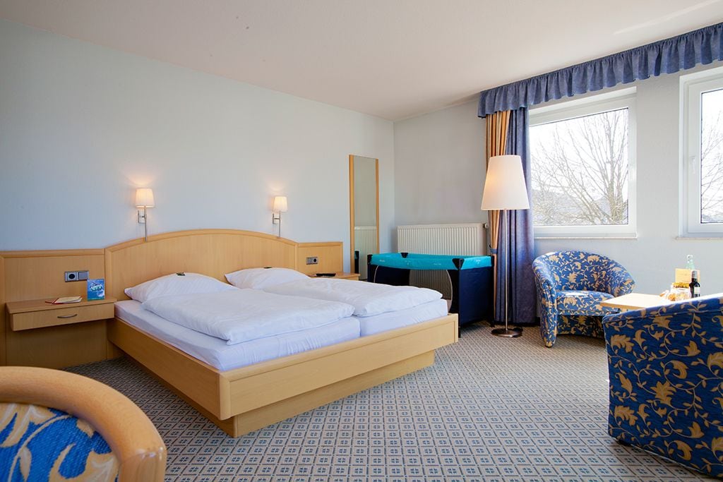 family room | desk, blackout curtains, soundproofing, iron/ironing board