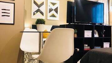 Comfort Studio | Living area | Flat-screen TV