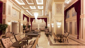 A spacious lobby with multiple seating areas, including sofas and armchairs, arranged around a central coffee table. - Miss Istanbul Hotel & Spa (Istanbul)