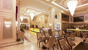 A luxurious lobby with chandeliers, a bar area, and seating arrangements. - Miss Istanbul Hotel & Spa (Istanbul)