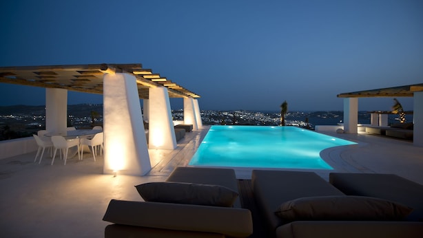 A rooftop pool with a view of the city at dusk. - Villa Opal (Mykonos)